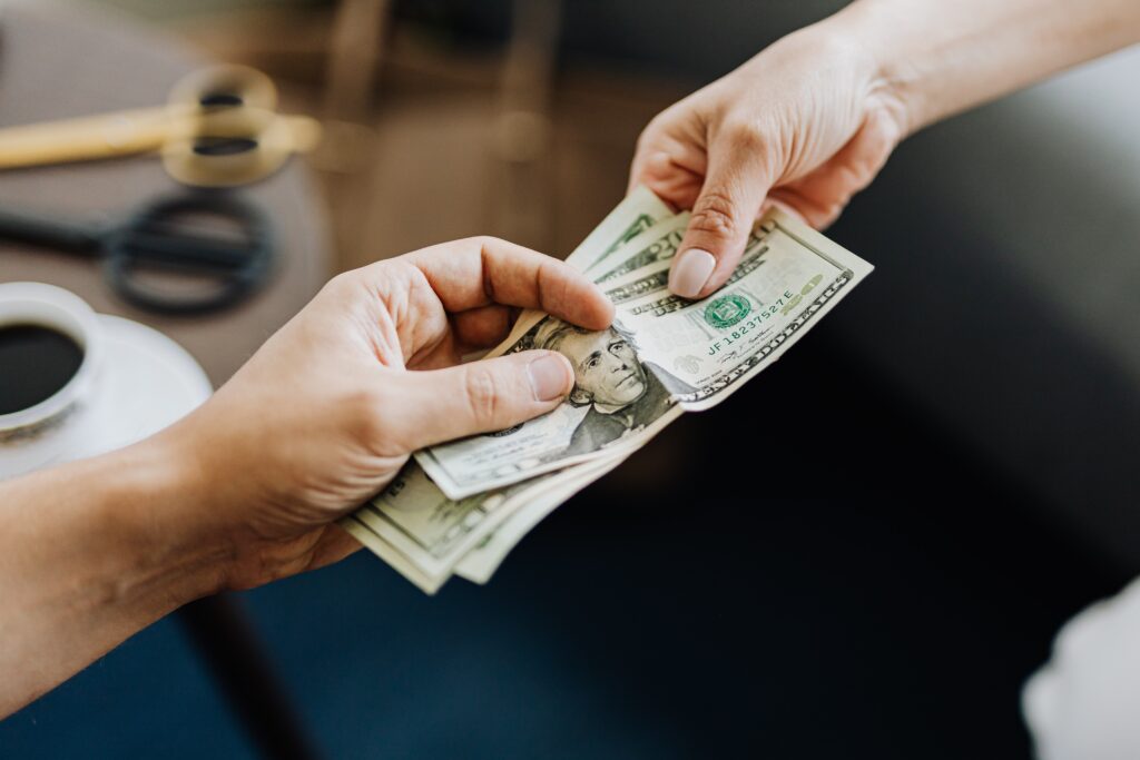 hand holding dollar bills image