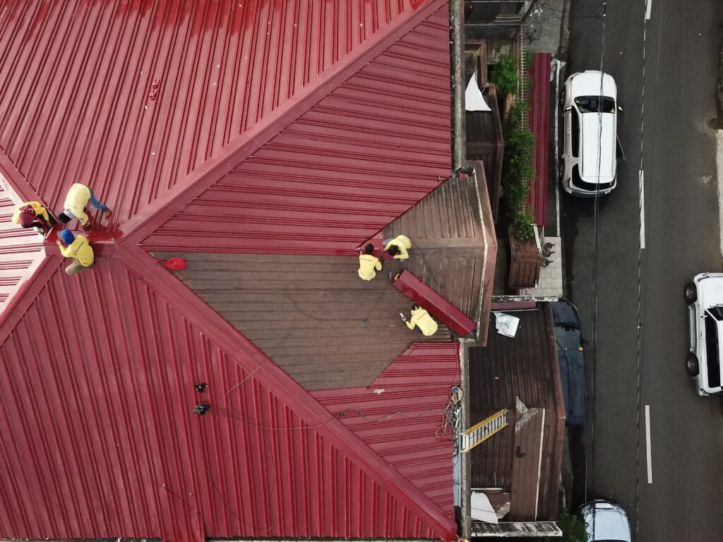 people repairing house roof image