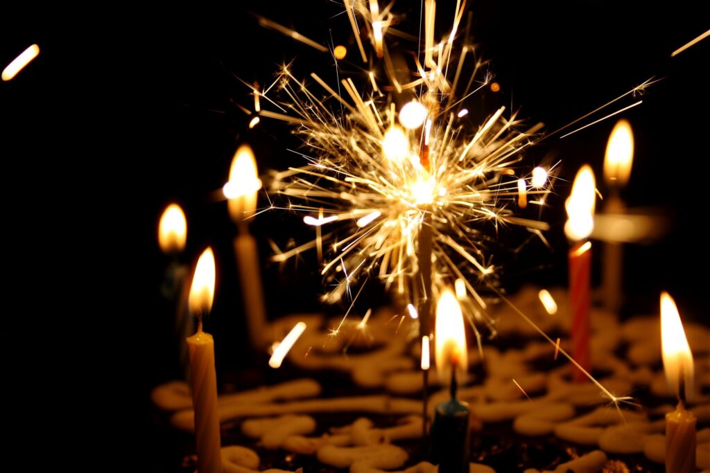 sparkler beside candles image
