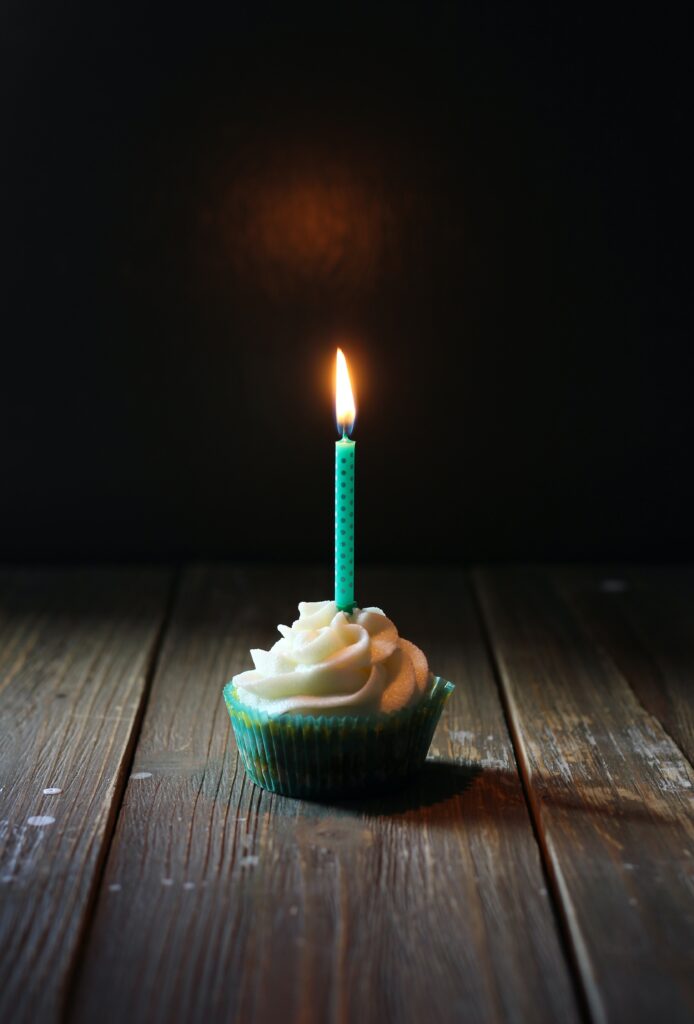 taper candle on cupcake image