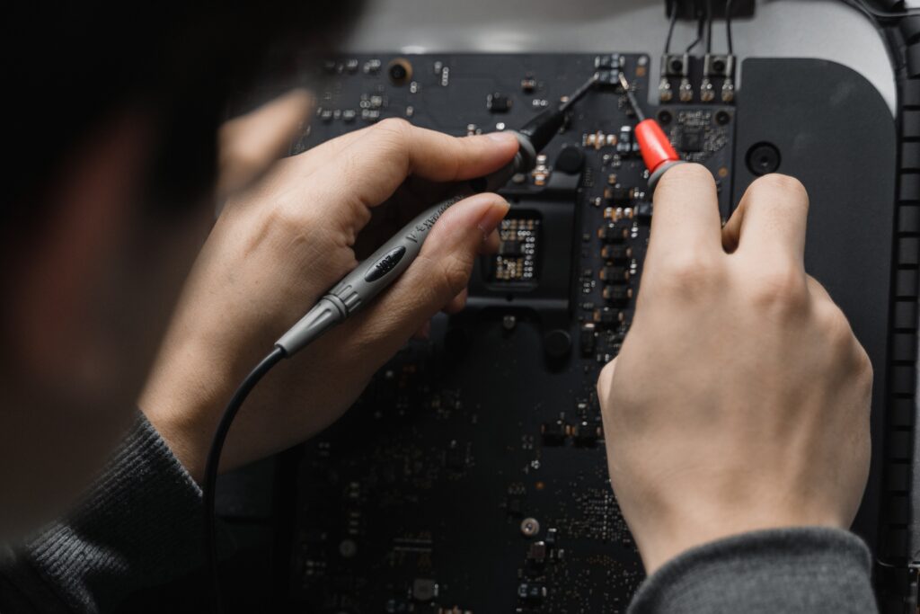 A person working on a circuit board image