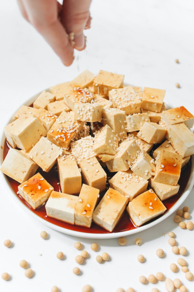 Tofu in a bowl covered with sesame seeds image