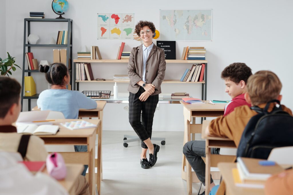 teacher-standing-in-the-classroom image