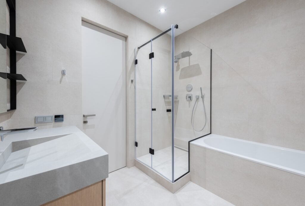 Bathroom with bath and shower near sink image