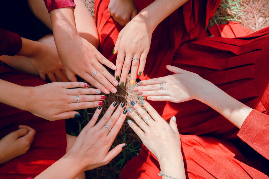 6 hands gathered in a circle
