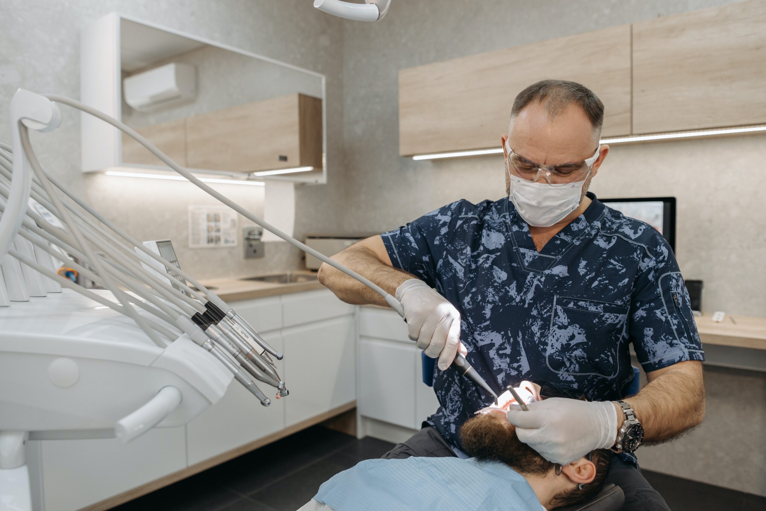 A dentist working on a patient image
