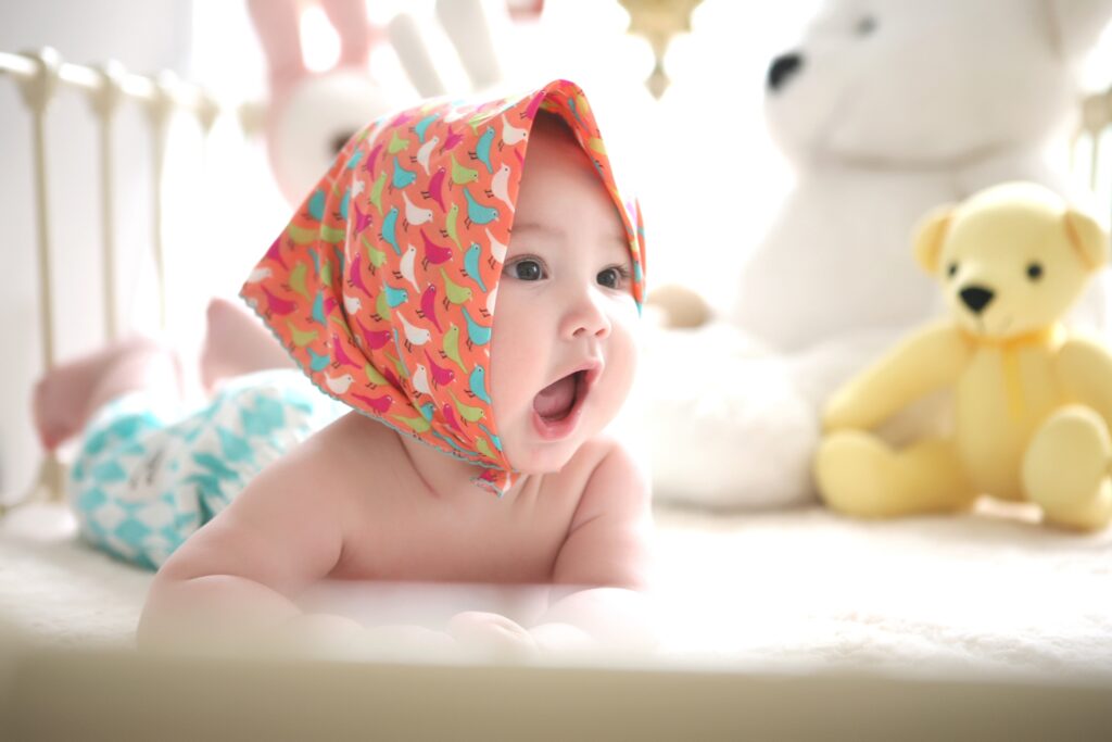Toddler Wearing Head Scarf in Bed
image