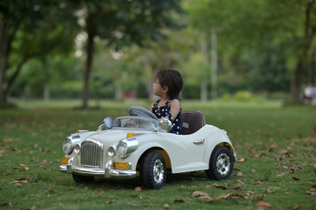 A Kid Riding a Toy Car