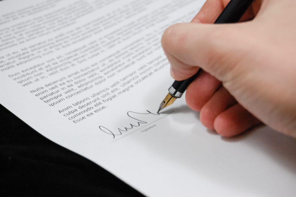 a person signing a contract image