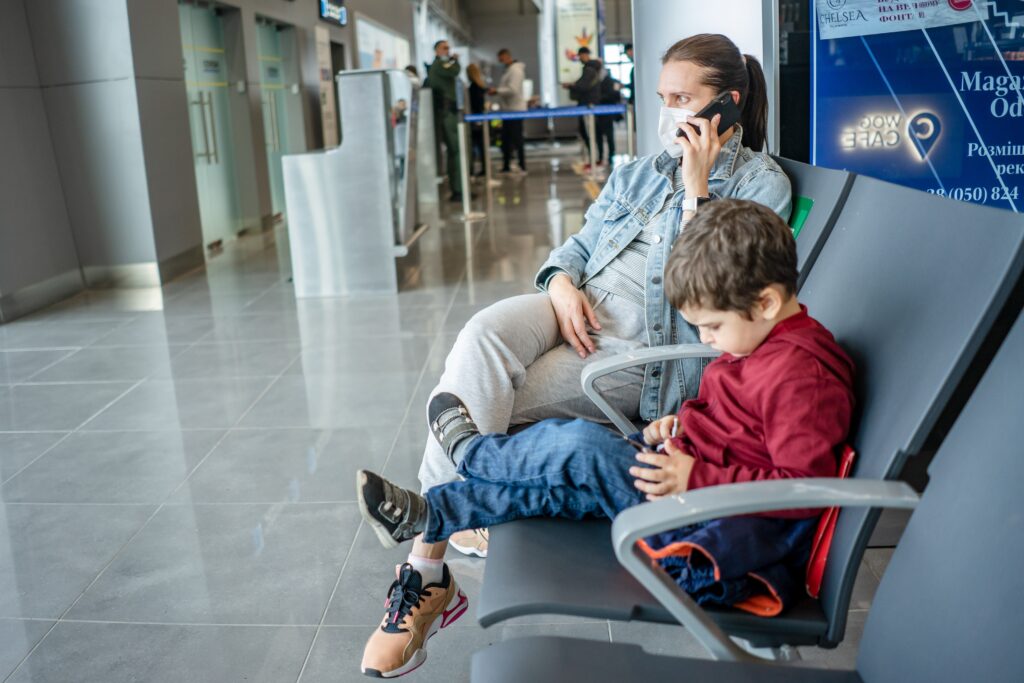mother and son at airport lounge image