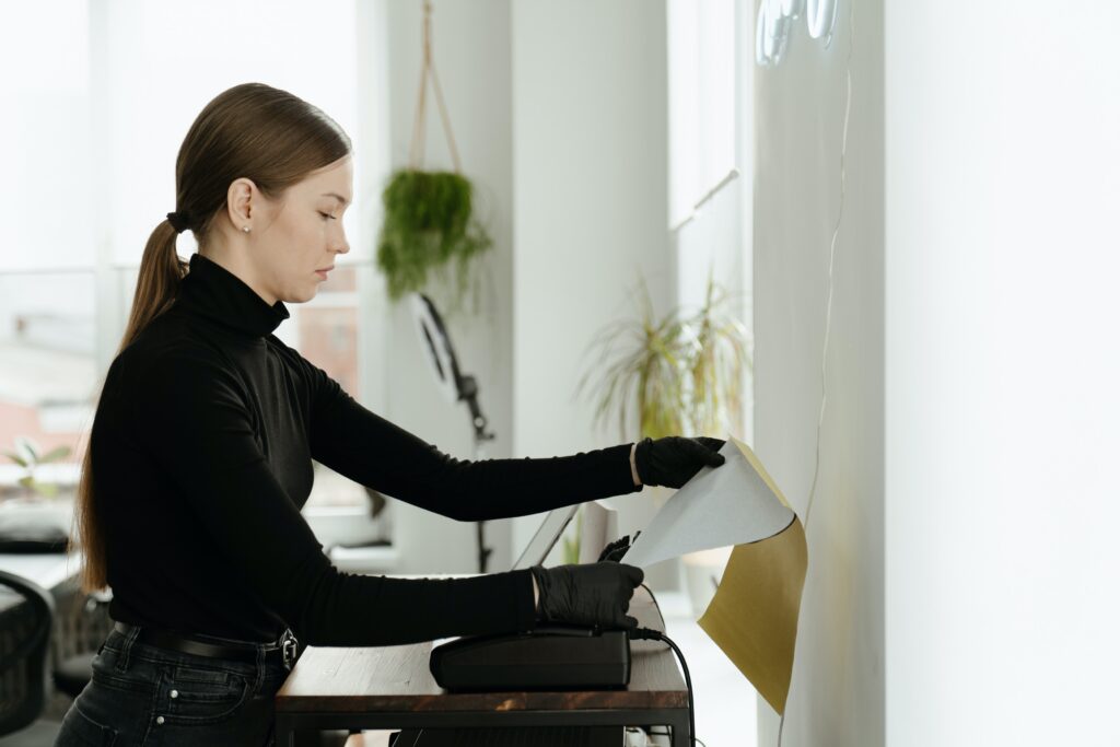 A woman printing using a printer image