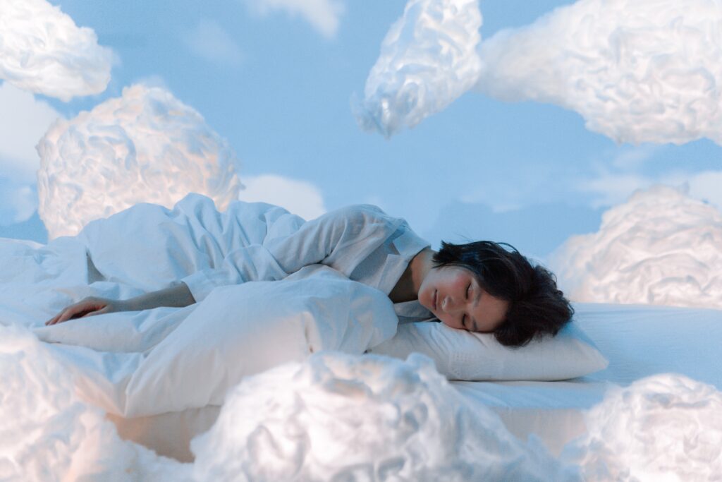An Image of a Woman dreaming of clouds