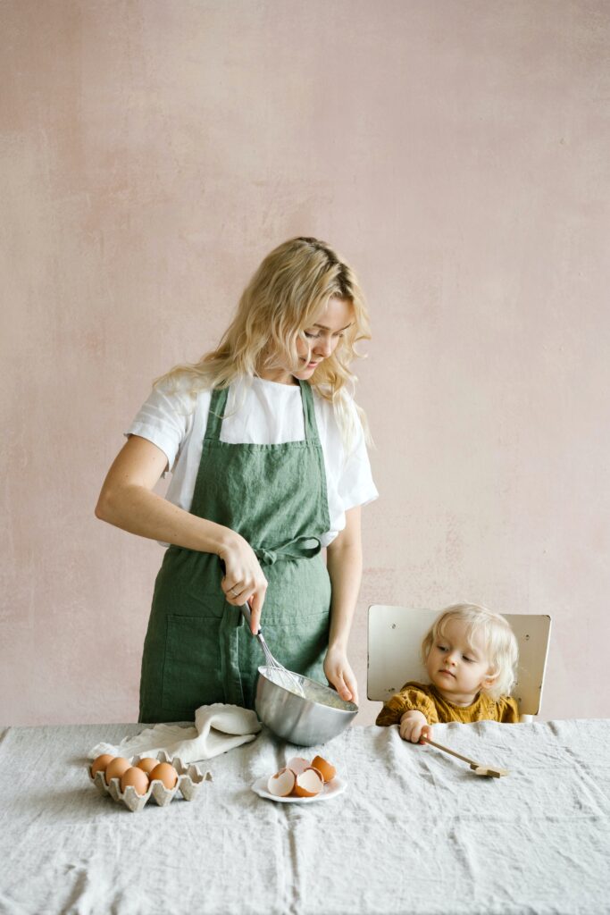  A mother and daughter baking together image
