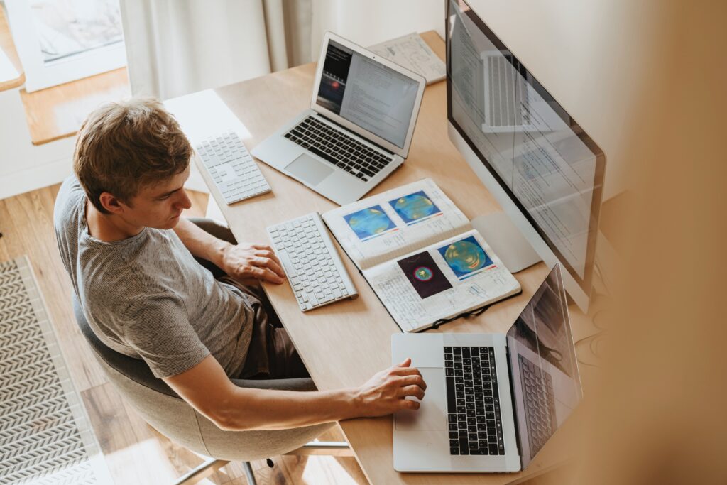 An Image of a Man using computers