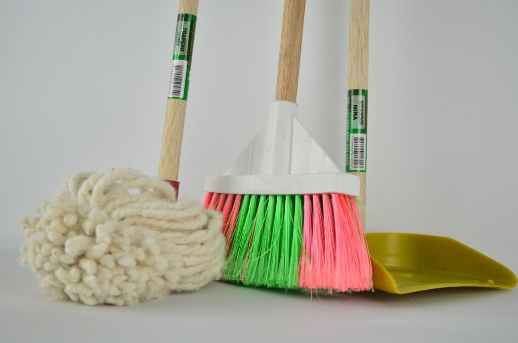a mop, broom, and dustpan image
