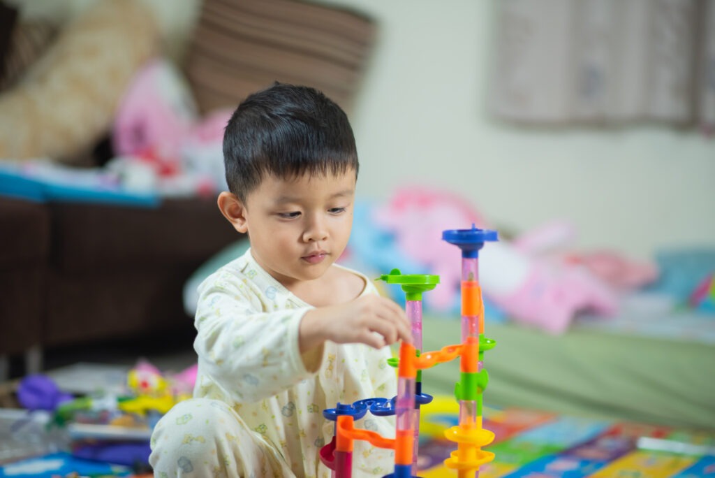 boy playing with toy image