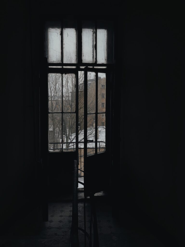 A half-open screen door image