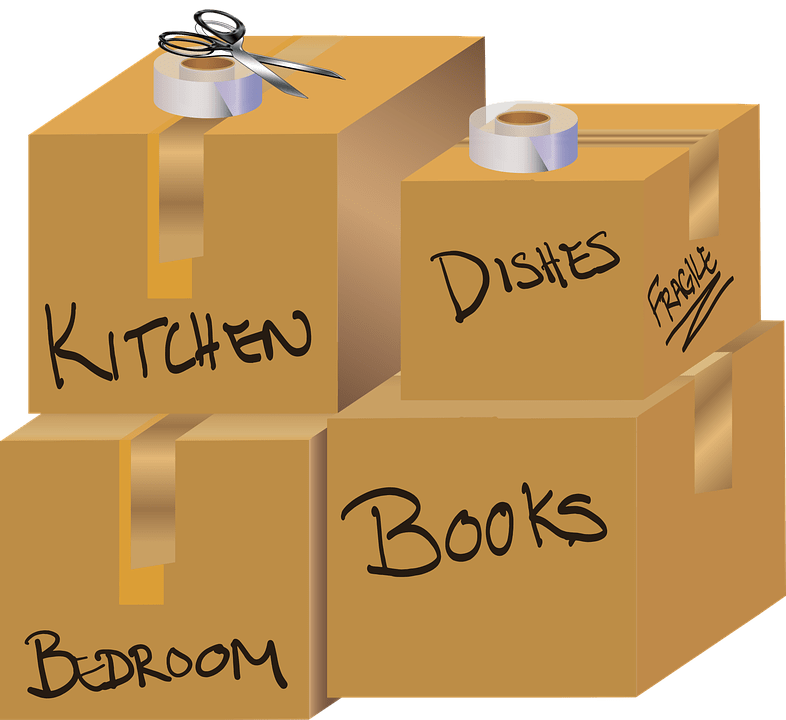 A pile of packed and labeled moving boxes image