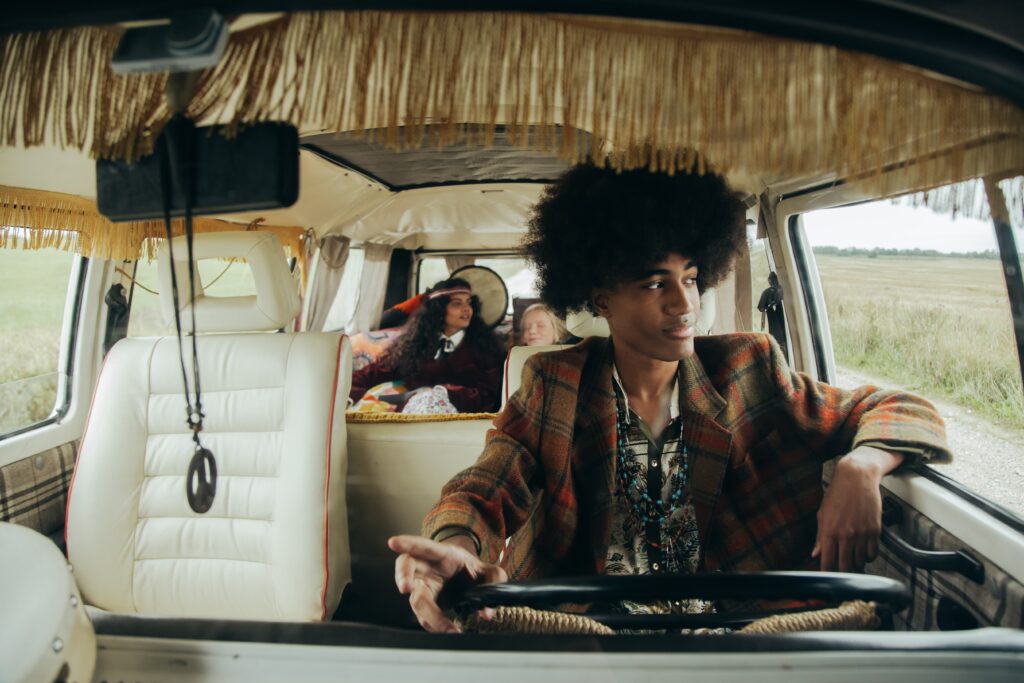 man-with-afro-hair-driving-a-van image