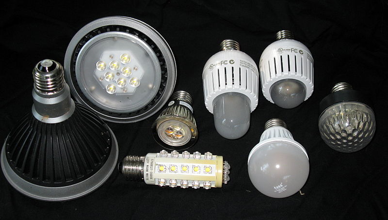 An assortment of LED lamps commercially available in 2010: floodlight fixtures (left), reading light (center), household lamps (center right and bottom), and low-power accent light (right) applications