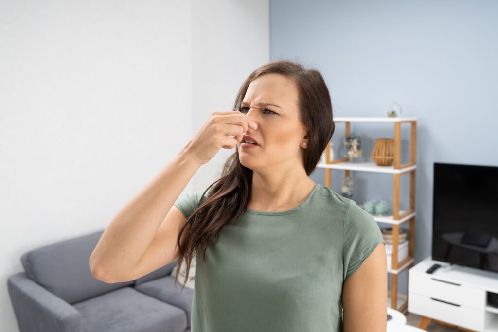 woman-covering-her-nose-from-bad-smell image