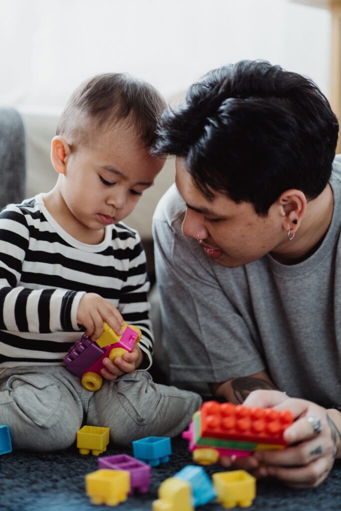 Father Playing with Toys with His Son image