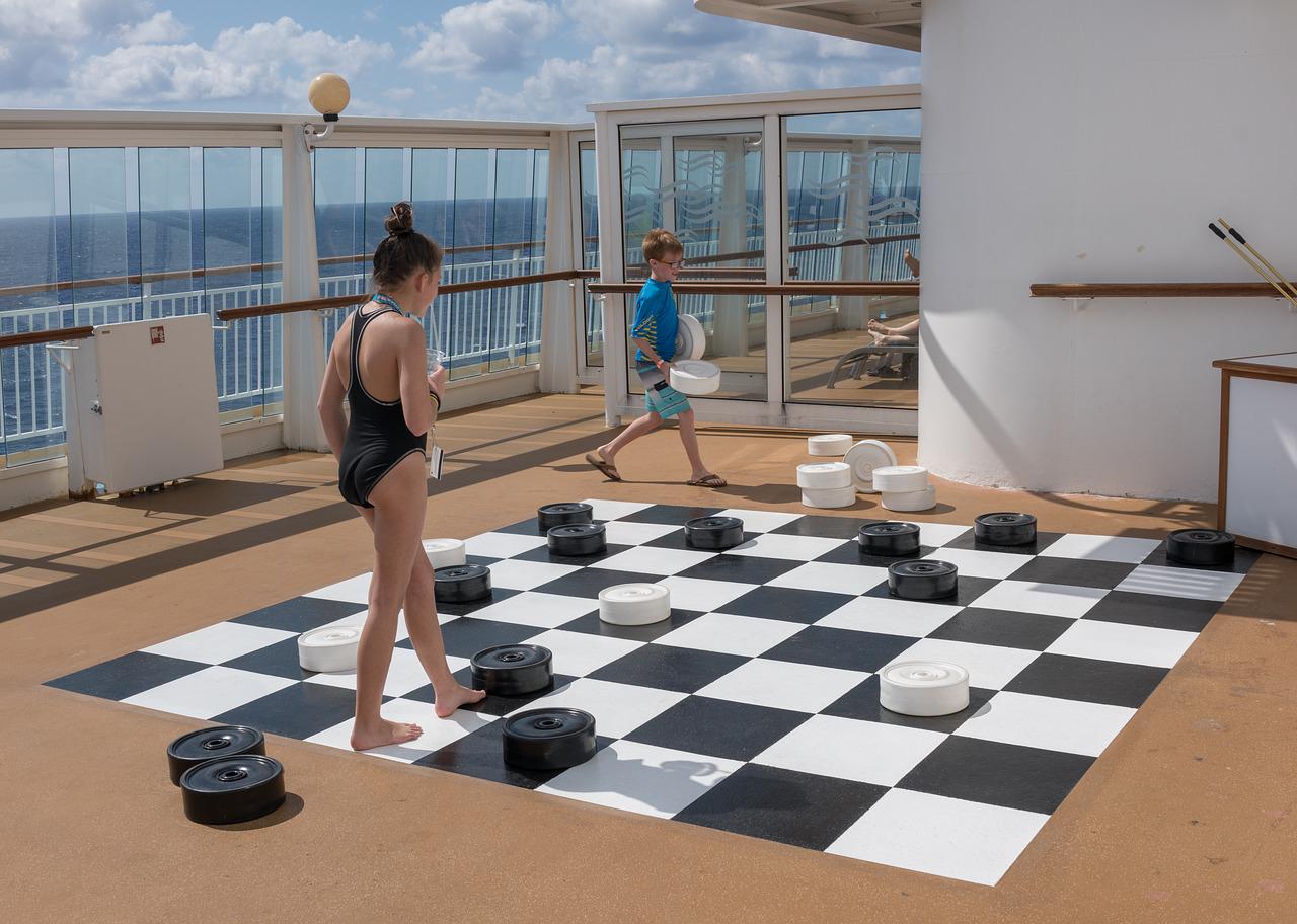 children on board of a cruise ship playing checkers