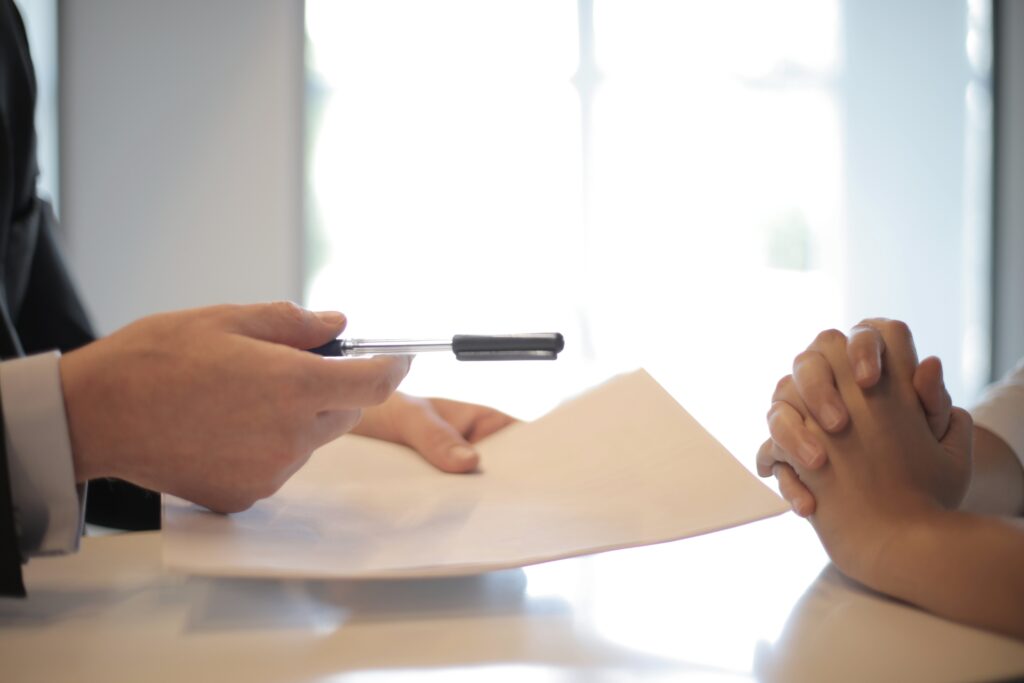 Two people discussing a contract