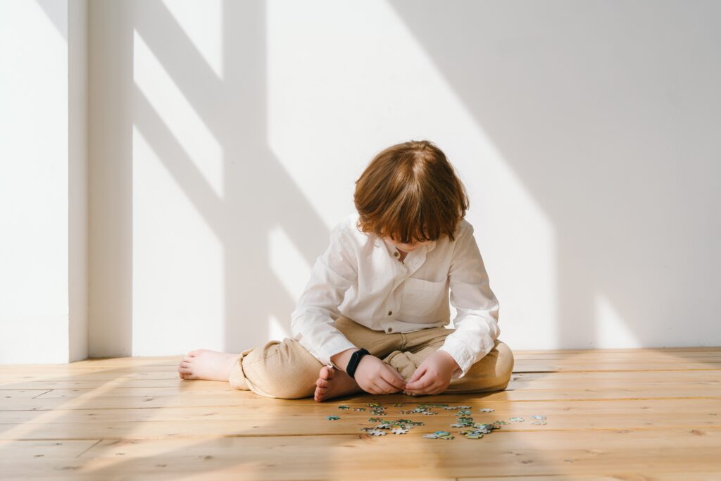 A boy playing with a puzzle
