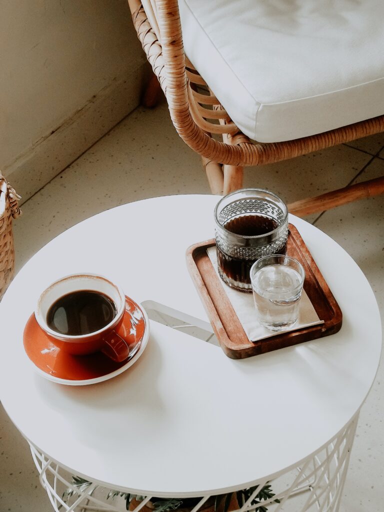 Black Coffee and Water on a Coffee Table