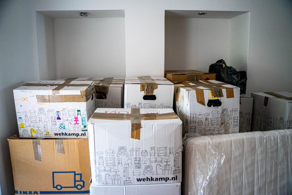 boxes of stuff in an empty room image