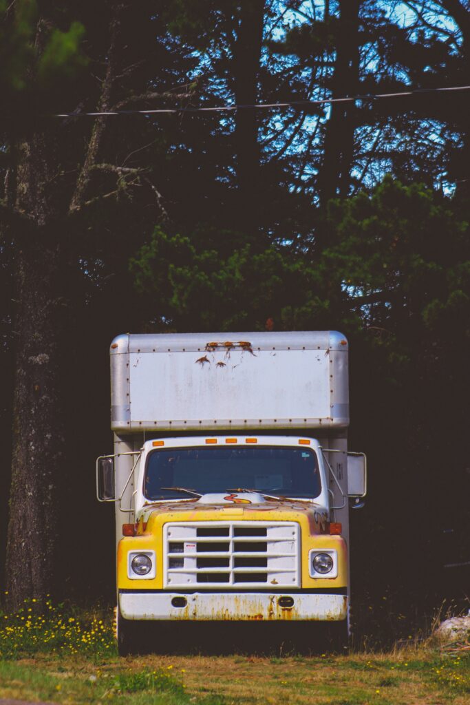 white and yellow box truck image