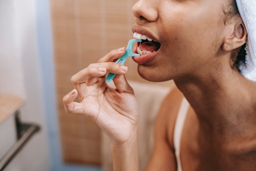 A woman flossing image
