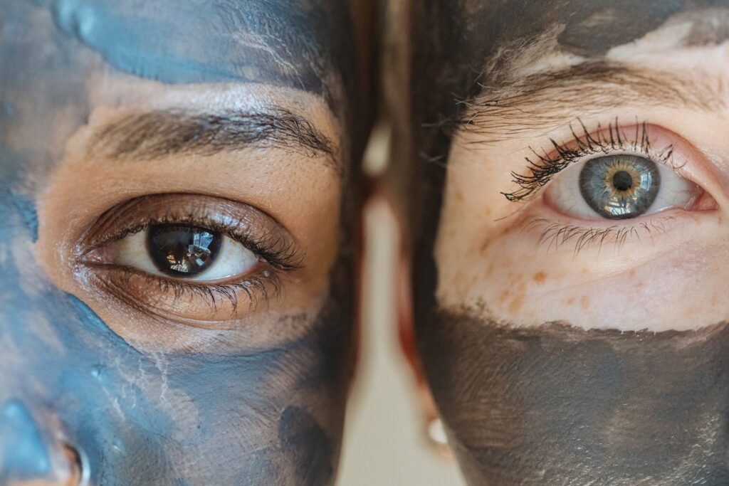 Multiethnic Women With Clay Mask On Faces