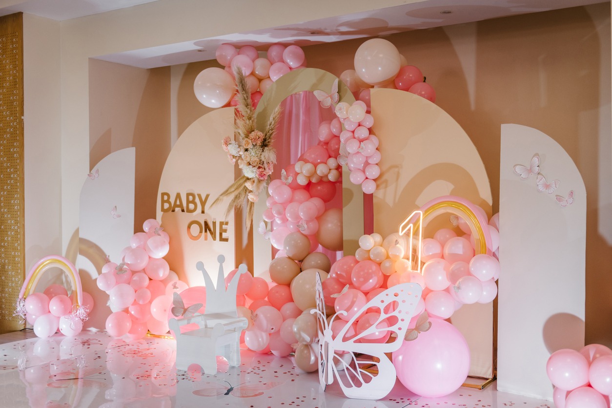 Birthday party for 1 year old girl on a background photo wall