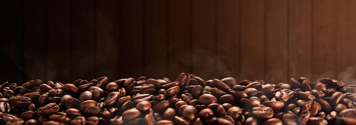 Roasted coffee beans with wooden background