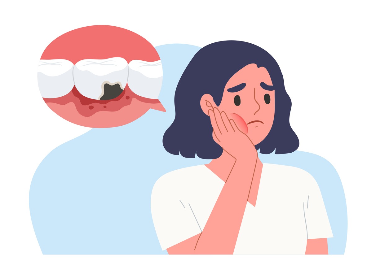 a woman holding her cheek due to toothache