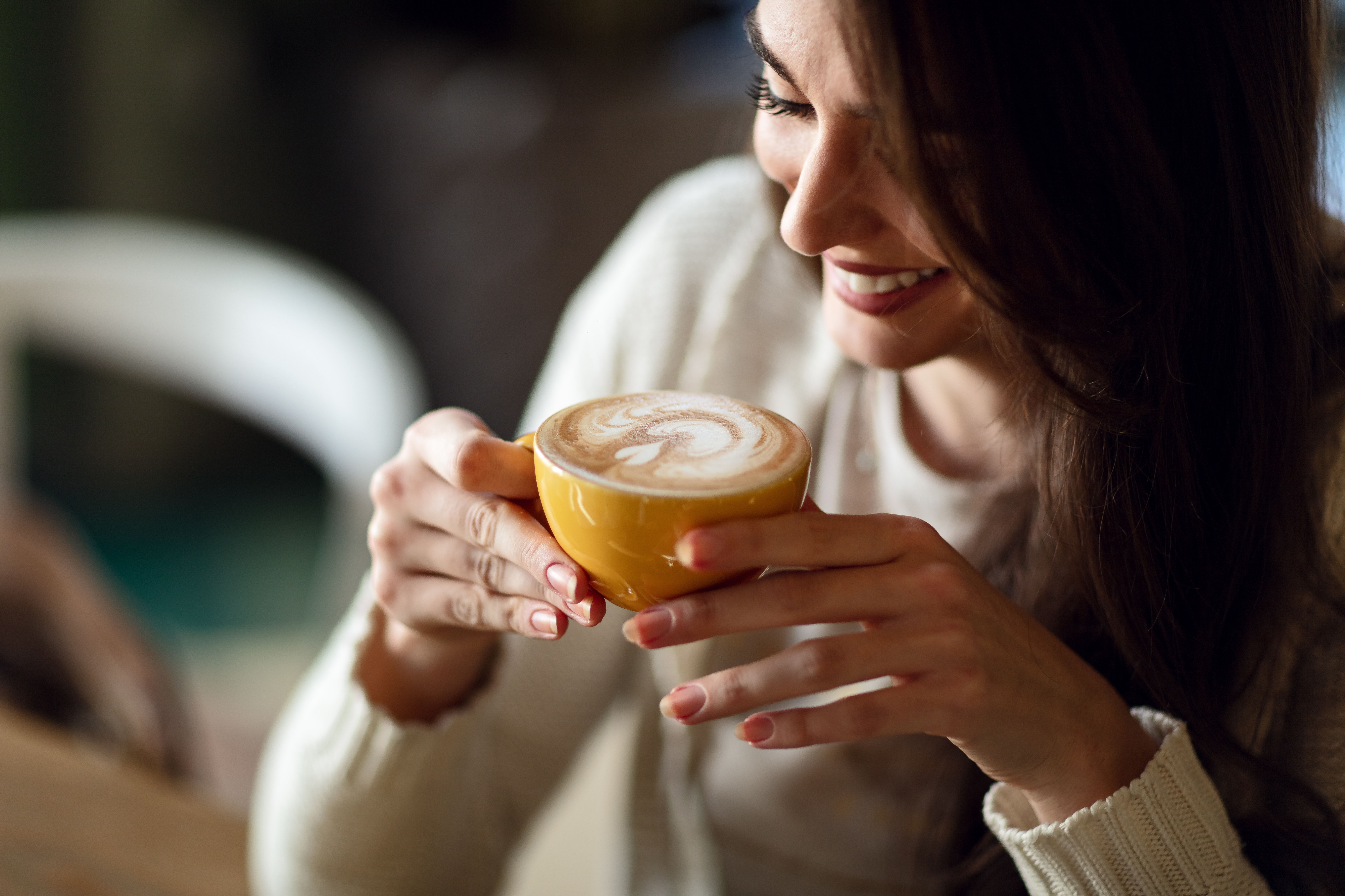 woman enjoying a cup of coffee image