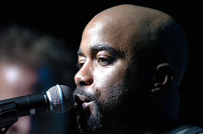 Rucker sings to a crowd during an Operation Pacific Greetings tour concert