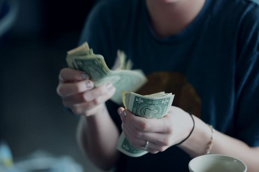 Woman counting dollars