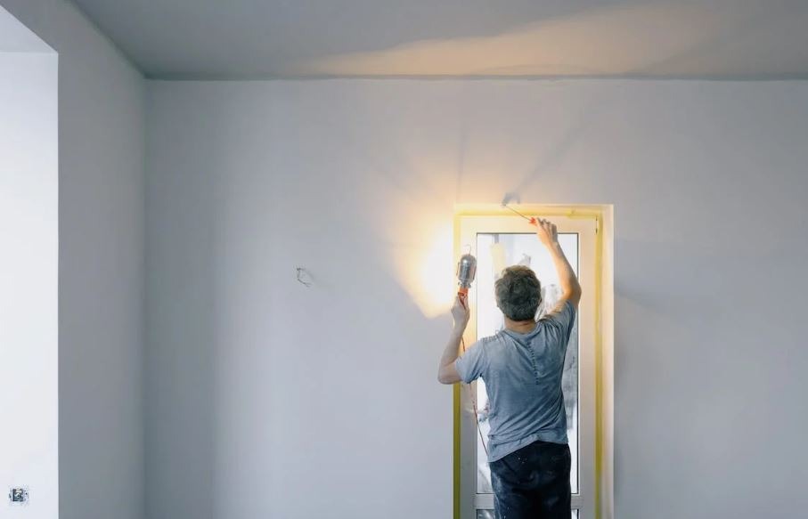 Man painting a door