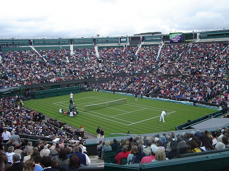 Modern-tennis-players-on-an-open-center-court-in-2008.