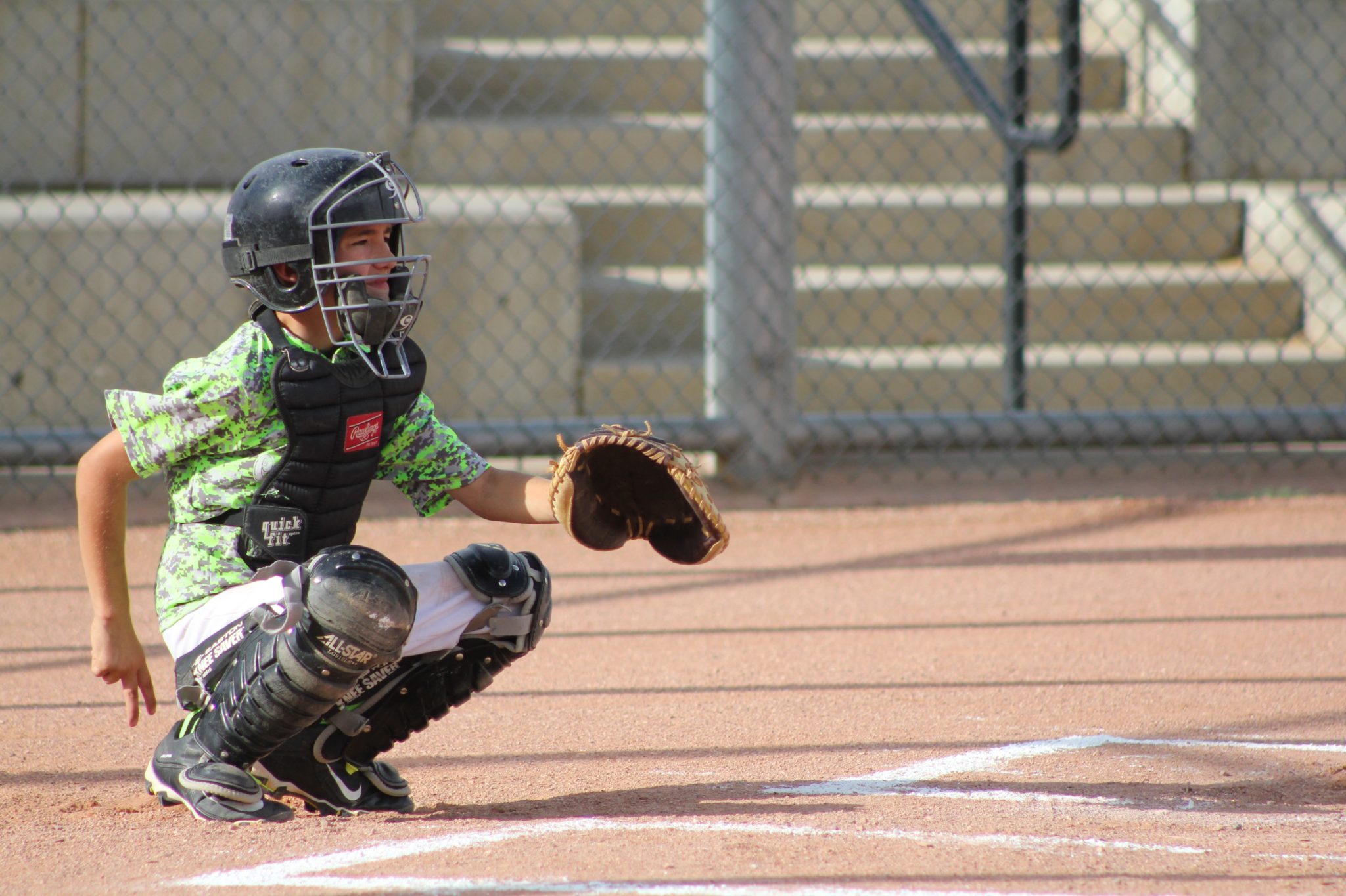 catchercrouching-on-field-giving-hand-signals
