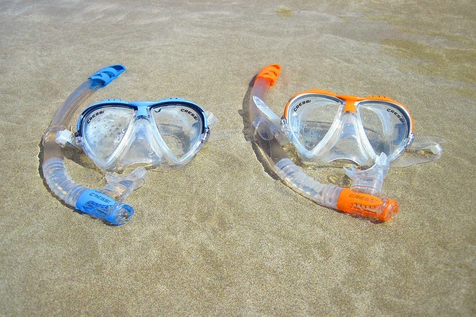 A-pair-of-diving-masks-lying-on-the-beach