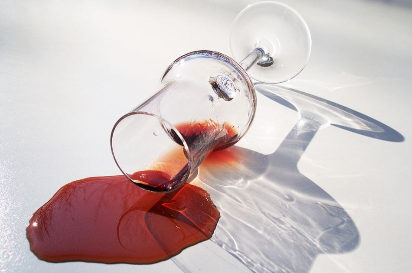 glass-lying-down-and-spilled-red-wine-spilled-alcohol