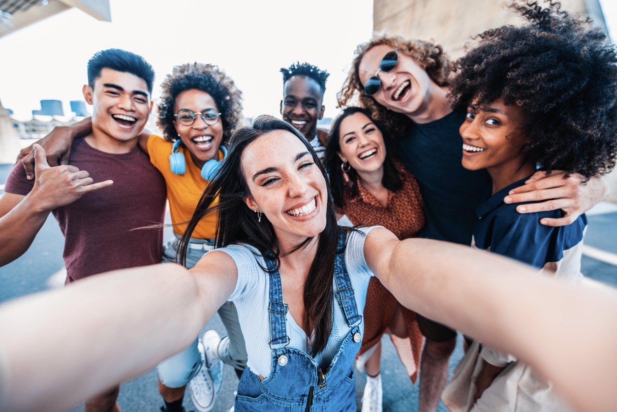 multicultural-happy-friends-having-fun-taking-group-selfie